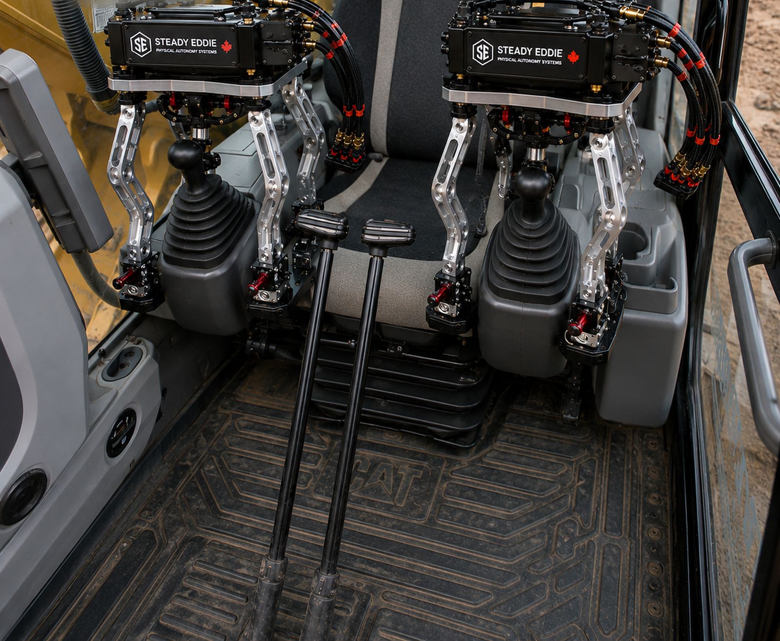 Eddie control units set on an excavator's own joysticks inside the cab — product render